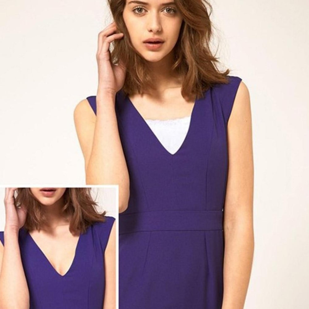 Modèle en violet qui porte un cache décolleté blanc